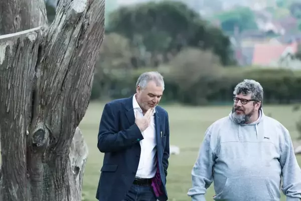 Two men in conversation