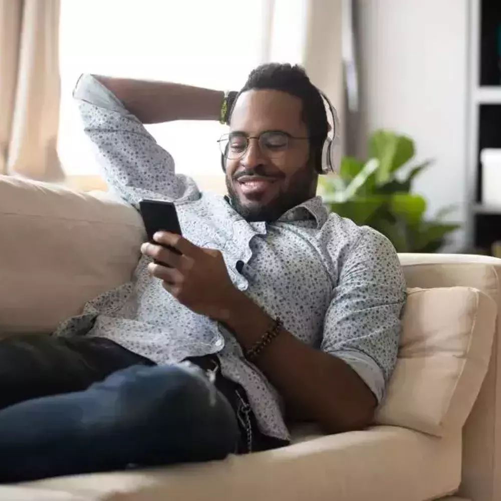 A man sitting on a sofa