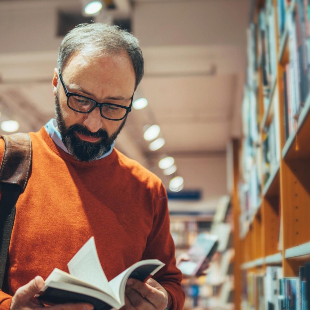 A man reading in a library