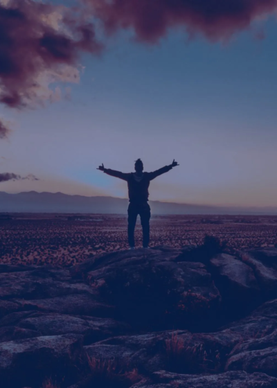 Image of someone stood in an open landscape