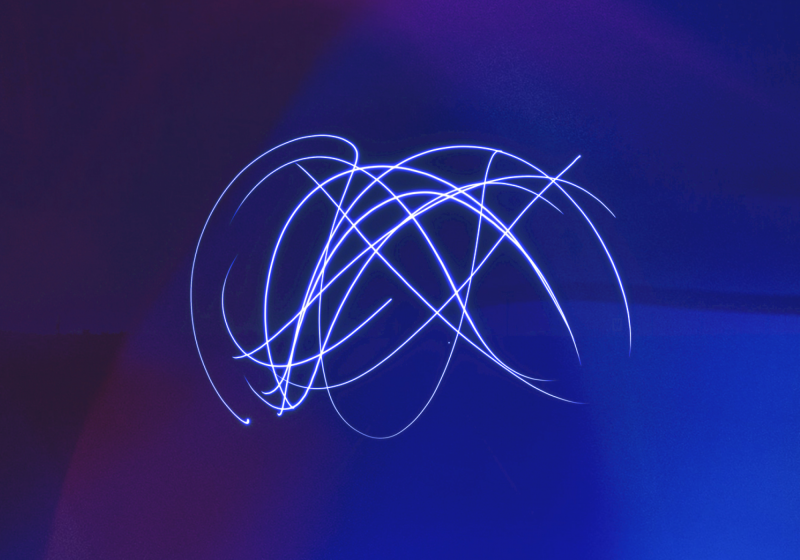 Electronically generated image of a blu background with swirling lines.